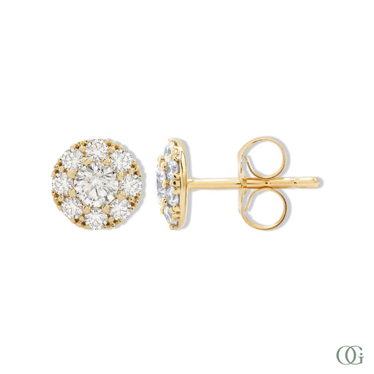 A pair of sparkling round diamond earrings with a gold band and smaller round diamonds set within.