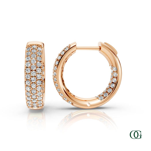 R | A pair of rose gold inside-out hoop earrings paved with round diamonds, displayed on a clean white background with a soft reflection below. 