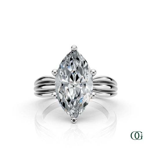 W | A white gold ring featuring a large marquise-cut clear gemstone in a prong setting, with a sculptural, ribbed shank.
