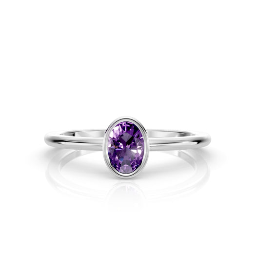 W| A white gold ring featuring an oval amethyst birthstone for February 