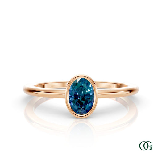 R| A rose gold ring featuring an oval alexandrite birthstone for June