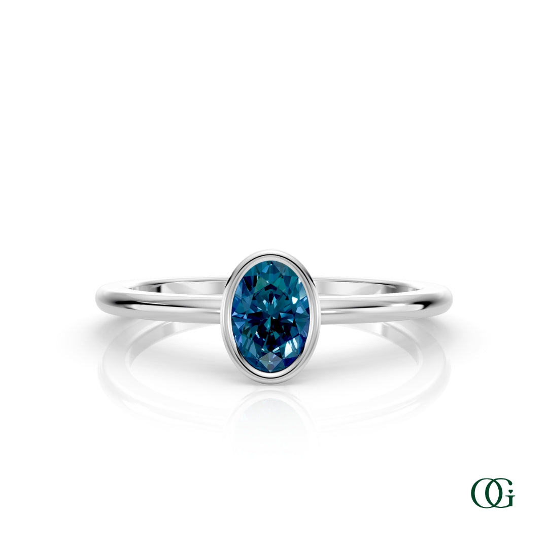 W| A white gold ring featuring an oval alexandrite birthstone for June