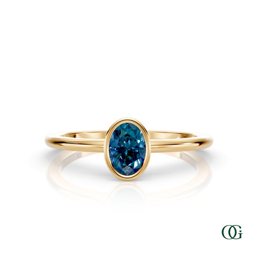 Y| A yellow gold ring featuring an oval alexandrite birthstone for June