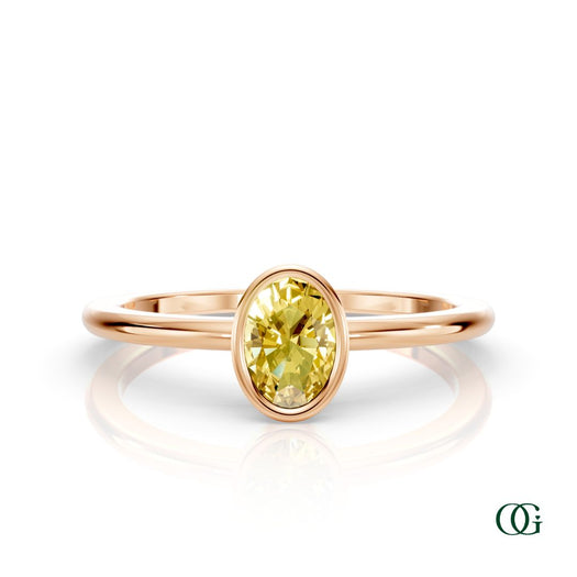 R| A rose gold ring featuring an oval citrine birthstone for November