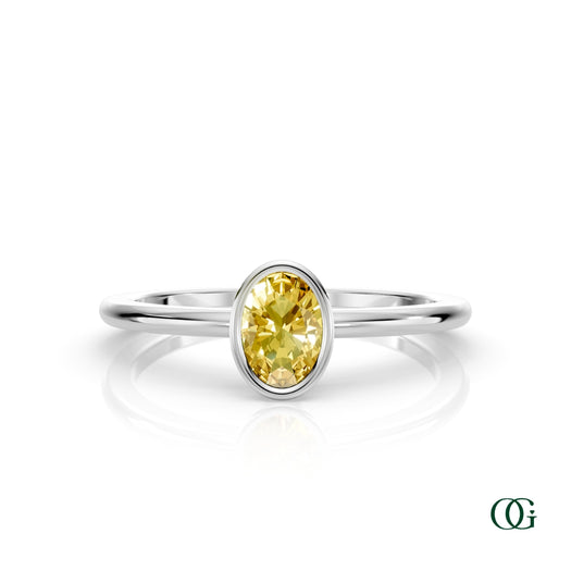 W| A white gold ring featuring an oval citrine birthstone for November