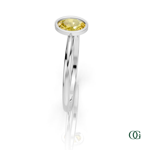 W| A white gold ring featuring an oval citrine birthstone for November