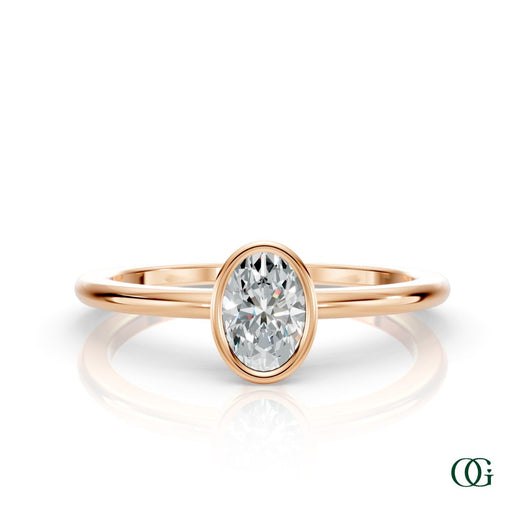 R| A rose gold ring featuring an oval diamond birthstone for April