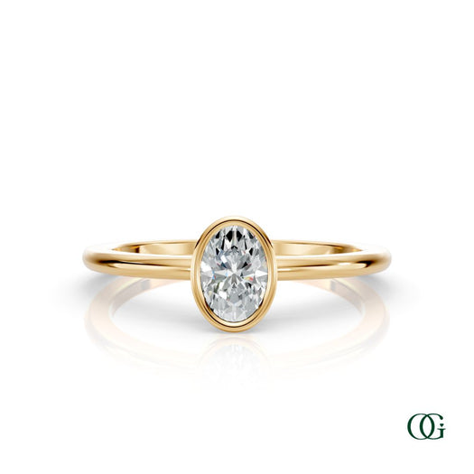 Y| A yellow gold ring featuring an oval diamond birthstone for April