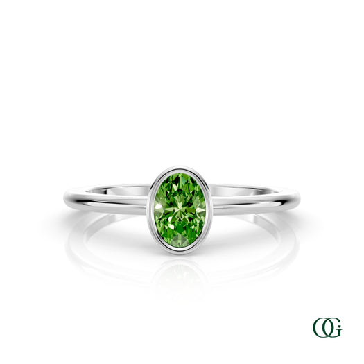 W| A white gold ring featuring an oval peridot birthstone for August