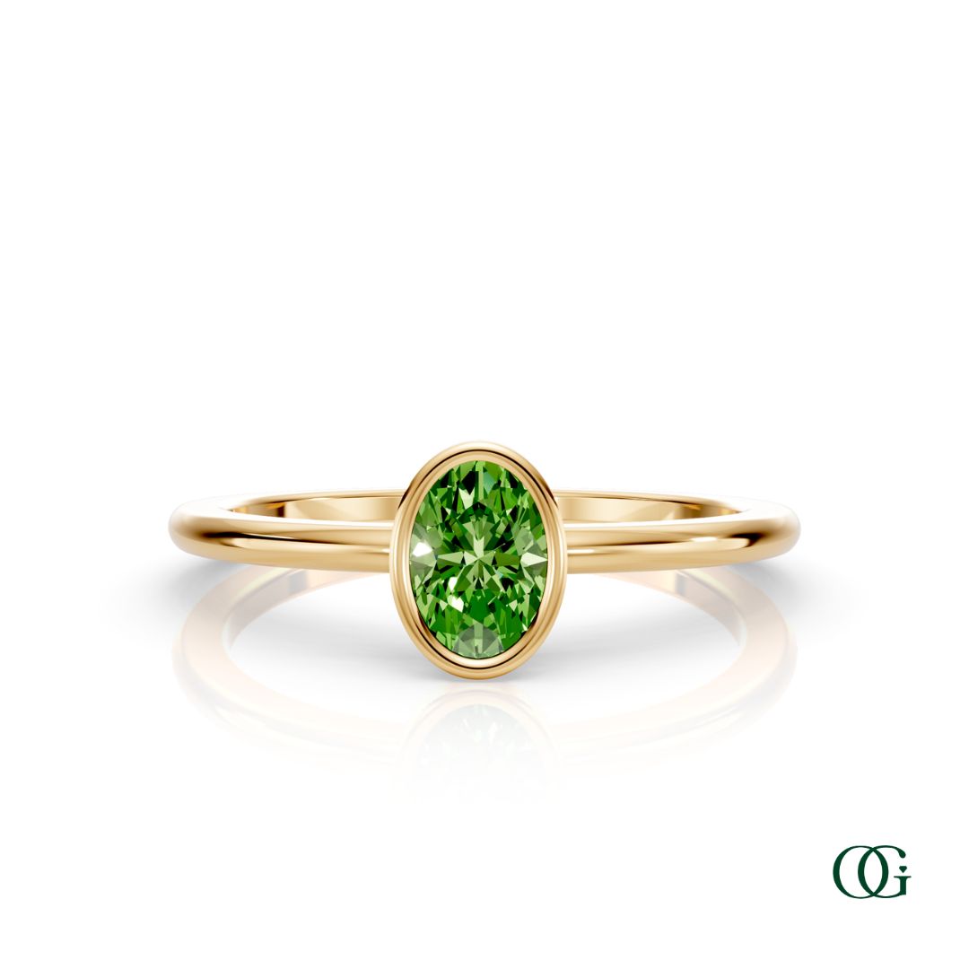 Y| A yellow gold ring featuring an oval peridot birthstone for August