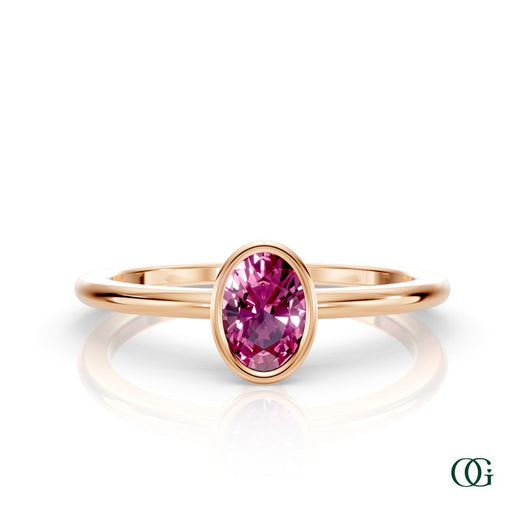 R| A rose gold ring featuring an oval tourmaline birthstone for October