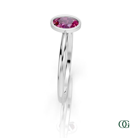 W| A white gold ring featuring an oval tourmaline birthstone for October