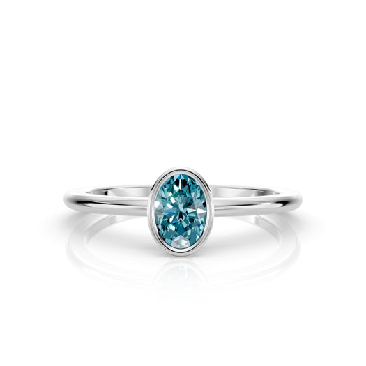 W| A white gold ring featuring an oval topaz birthstone for December
