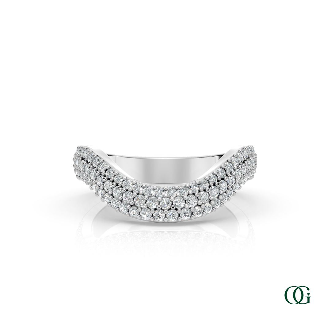 W | A curved white gold ring featuring three rows of round-cut diamonds