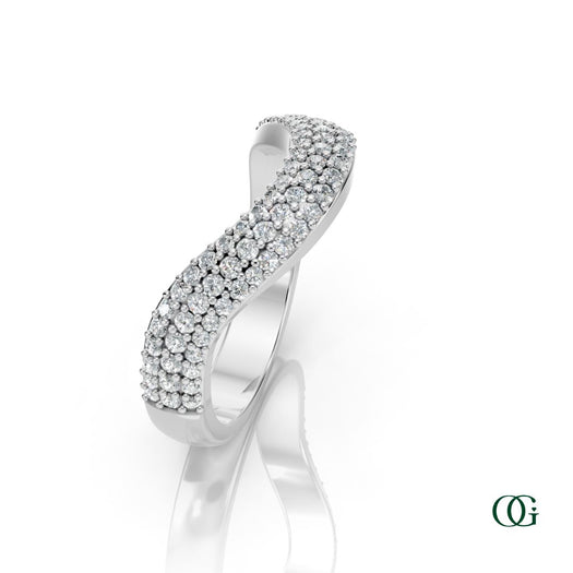 W | A curved white gold ring featuring three rows of round-cut diamonds