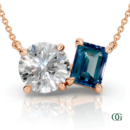 R | rose gold necklace with two stones: a round diamond center stone and an  emerald-cut alexandrite side stone.