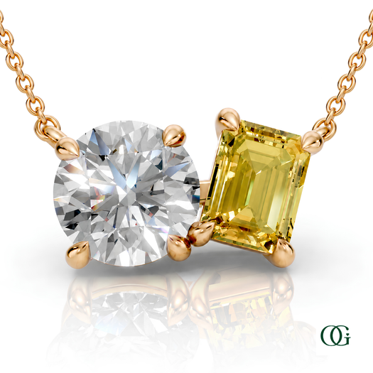 Y | gold necklace with two stones: a round diamond center stone and an  emerald-cut cetrine side stone.