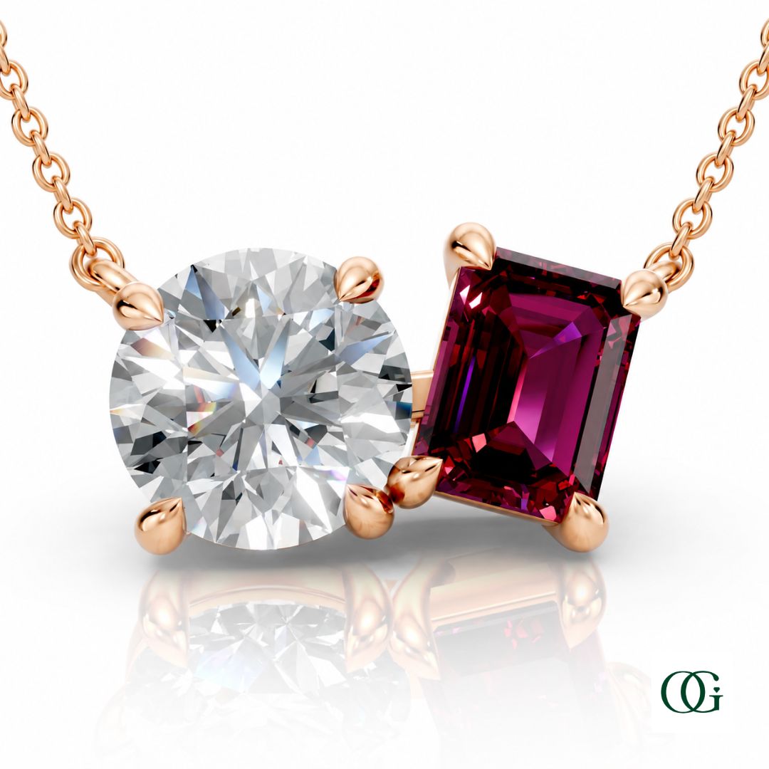 R | rose gold necklace with two stones: a round diamond center stone and an  emerald-cut garnet side stone.