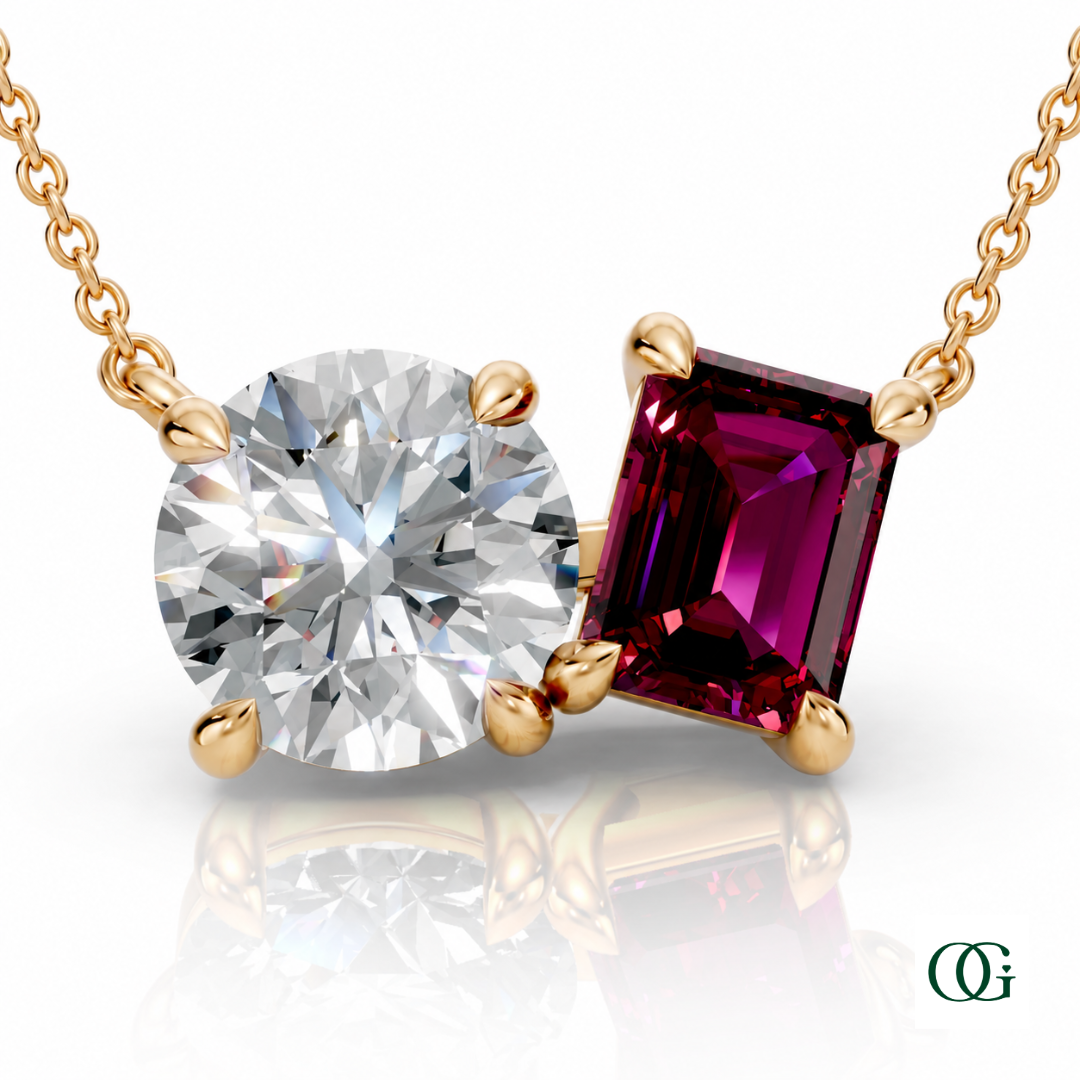 Y | gold necklace with two stones: a round diamond center stone and an  emerald-cut garnet side stone.
