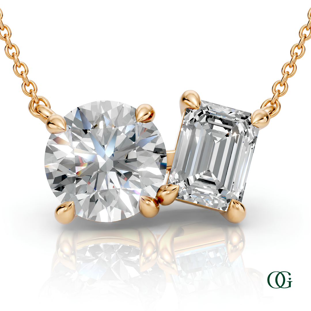 Y | gold necklace with two stones: a round diamond center stone and an  emerald-cut natural diamond side stone.