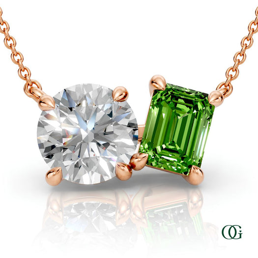 R | rose gold necklace with two stones: a round diamond center stone and an  emerald-cut peridot side stone.