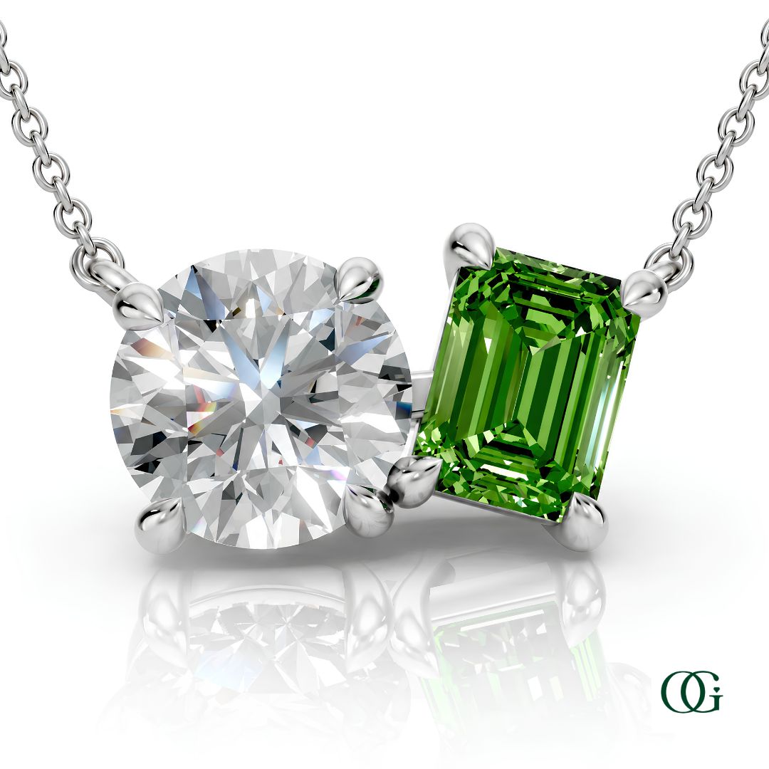 W | white gold necklace with two stones: a round diamond center stone and an  emerald-cut peridot side stone.