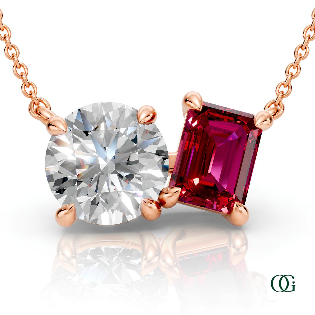 R | rose gold necklace with two stones: a round diamond center stone and an  emerald-cut ruby side stone.