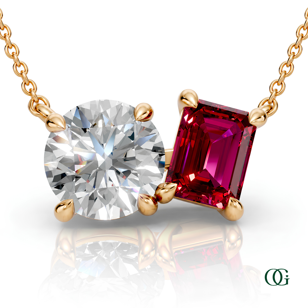 Y | gold necklace with two stones: a round diamond center stone and an  emerald-cut ruby side stone.