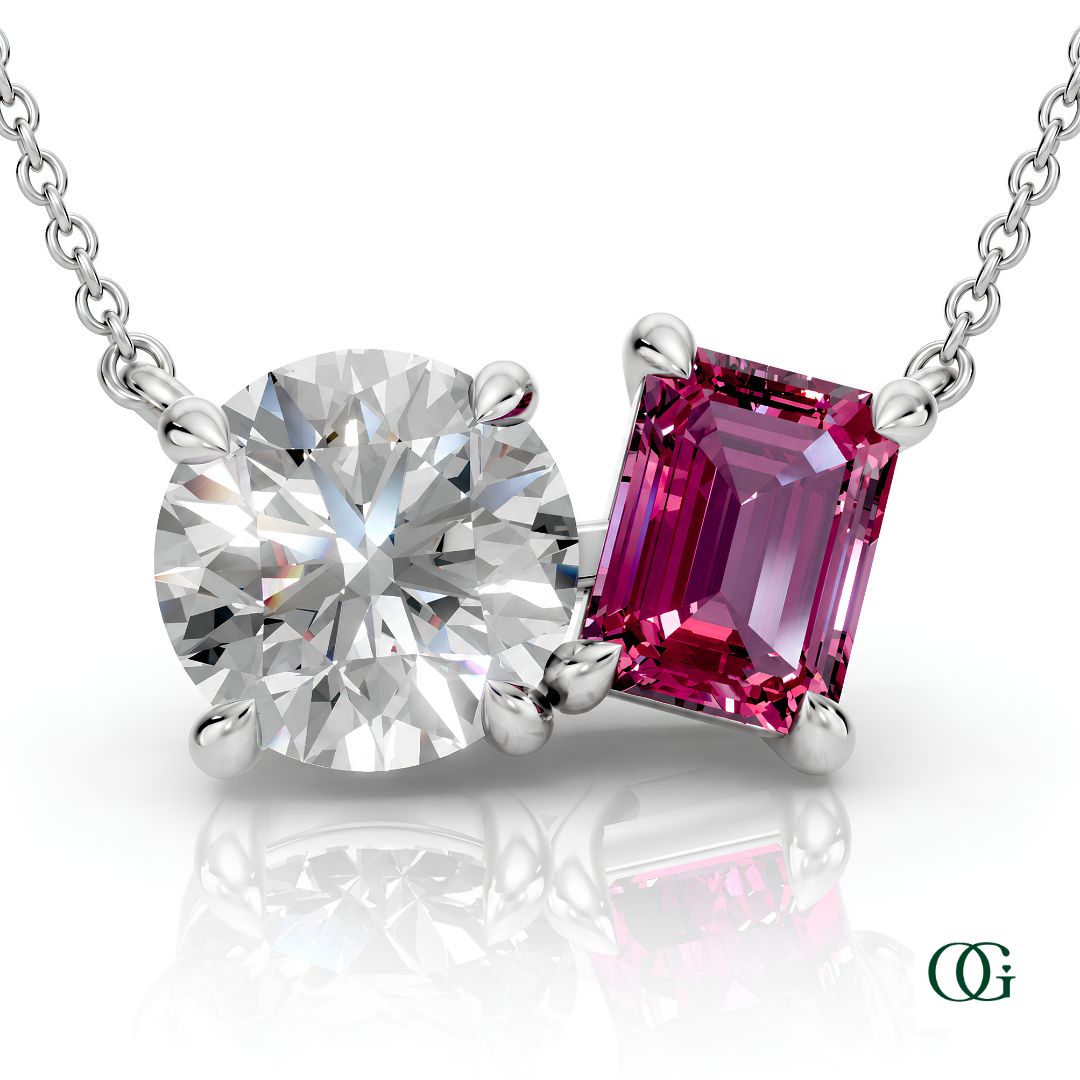 W | white gold necklace with two stones: a round diamond center stone and an  emerald-cut tourmaline side stone.