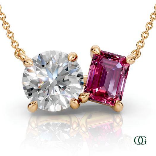 Y | gold necklace with two stones: a round diamond center stone and an  emerald-cut tourmaline side stone.