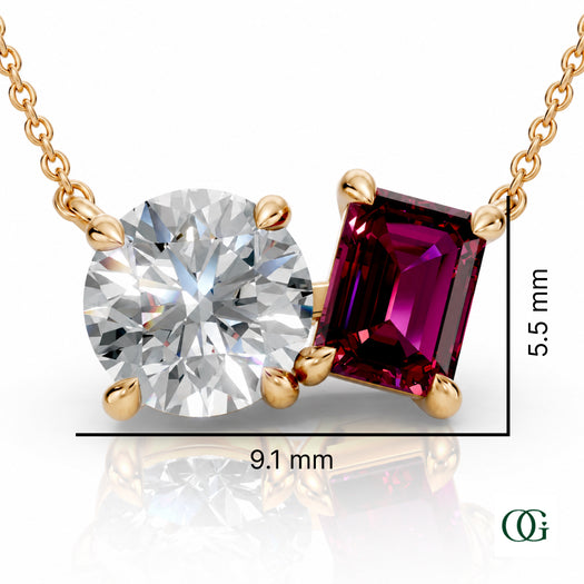 Y | gold necklace with two stones: a round diamond center stone and an  emerald-cut garnet side stone.